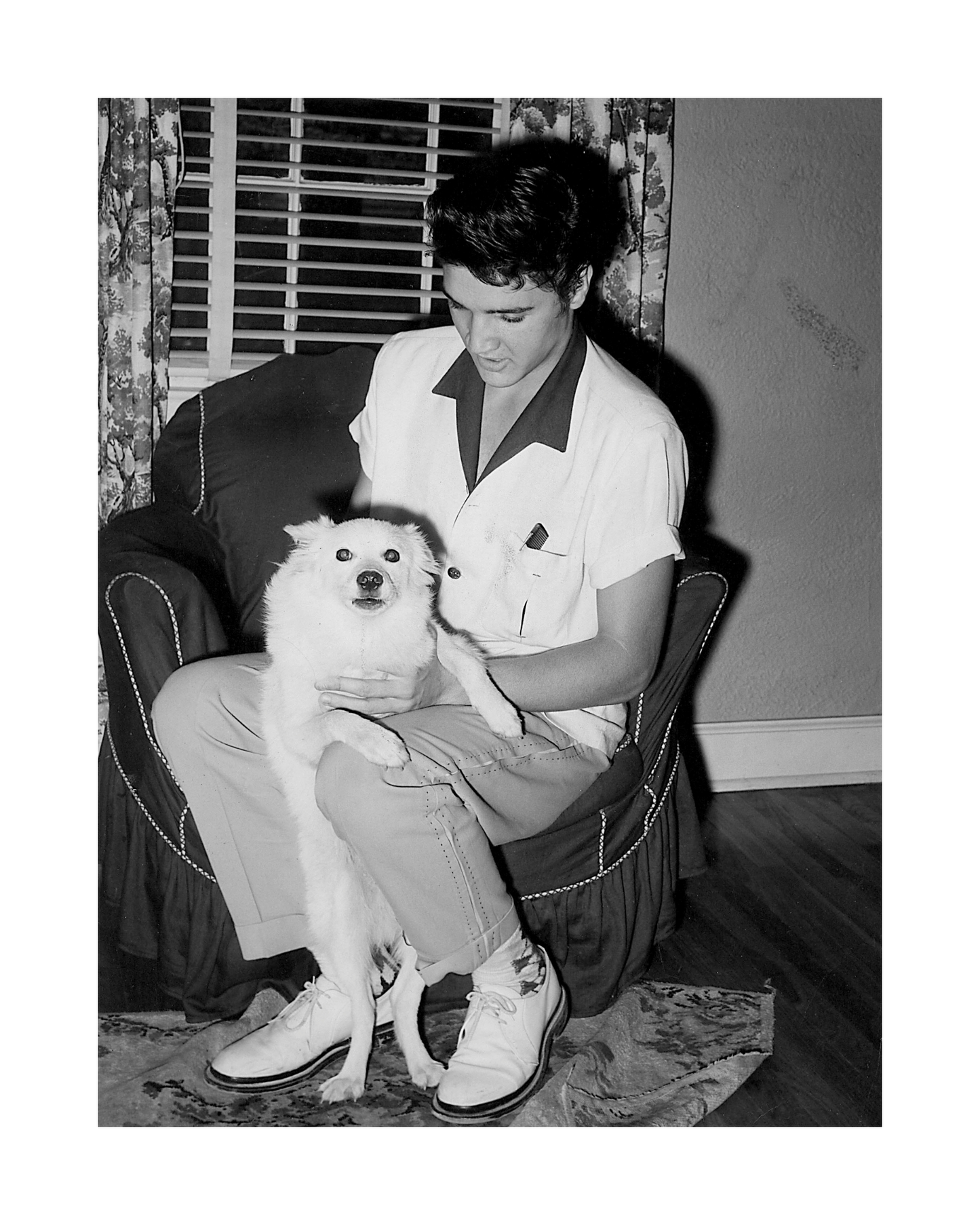 Elvis Presley Holding Dog