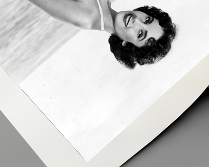 Elizabeth Taylor Kneeling on Beach