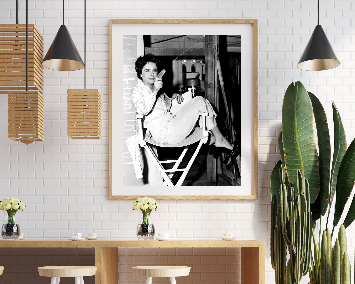 Liz Taylor Shooting Water Gun on the Set