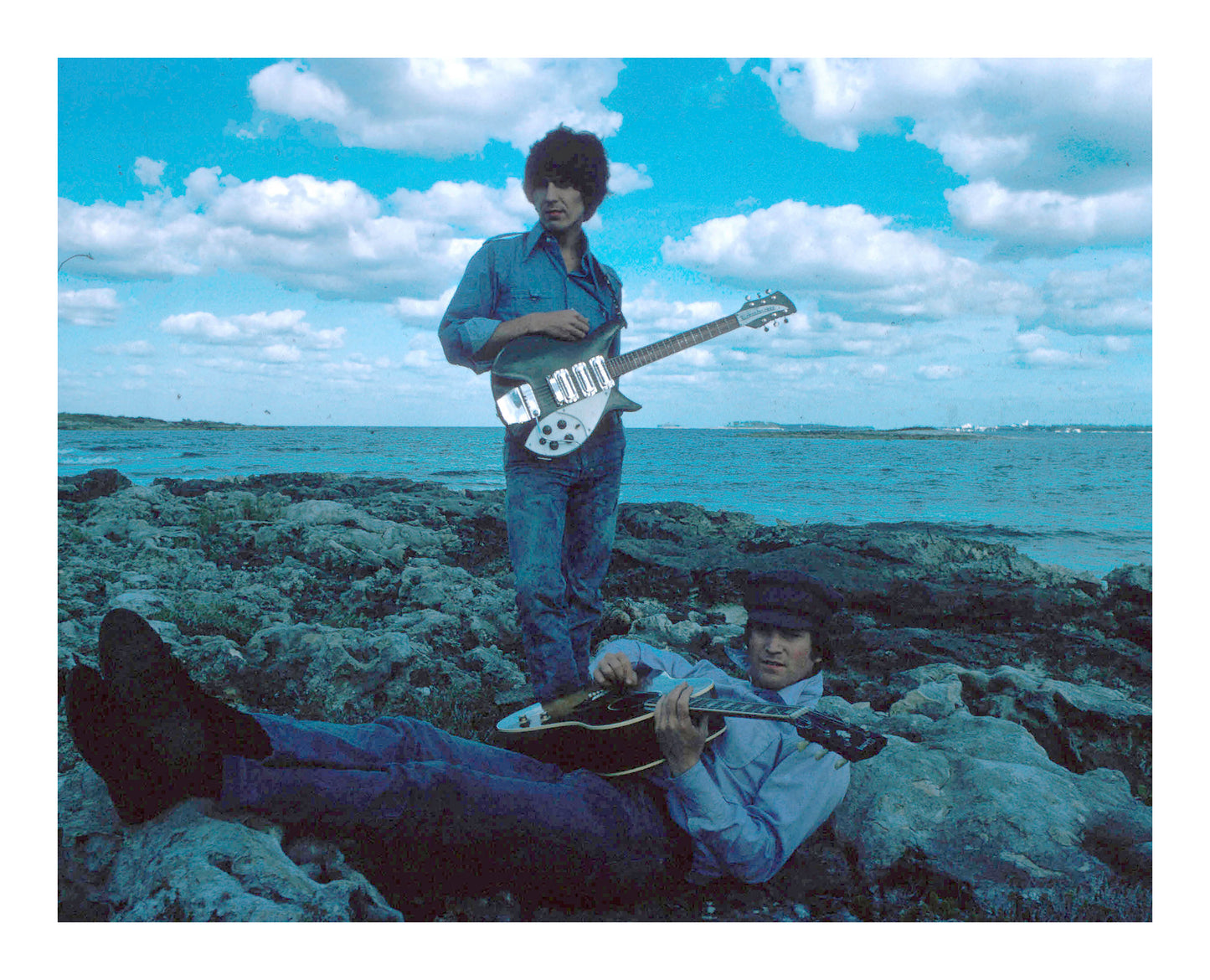 John Lennon and George Harrison at a Beach