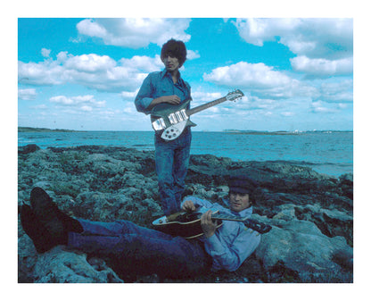 John Lennon and George Harrison at a Beach