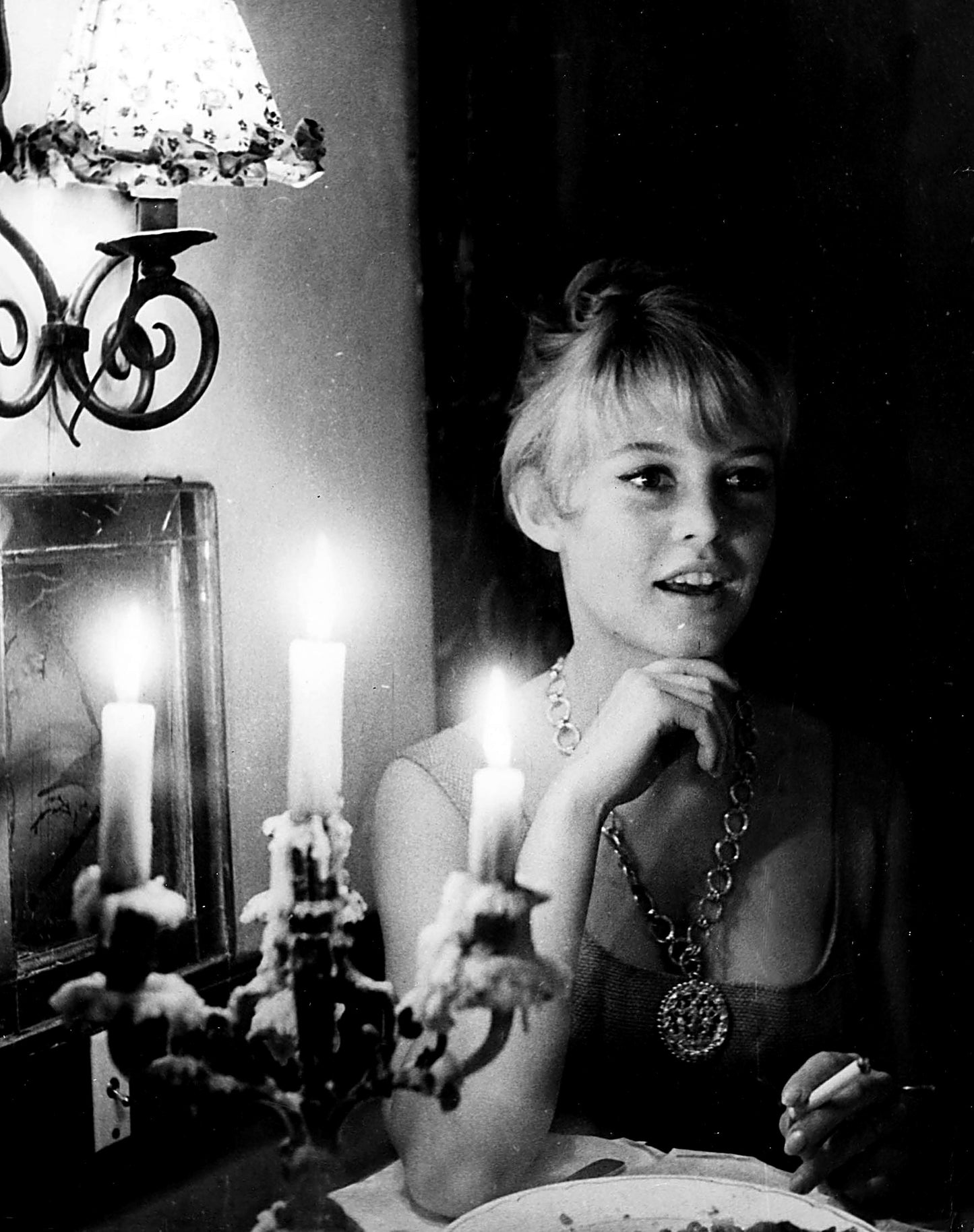 Brigitte Bardot Smoking by a Candelabra