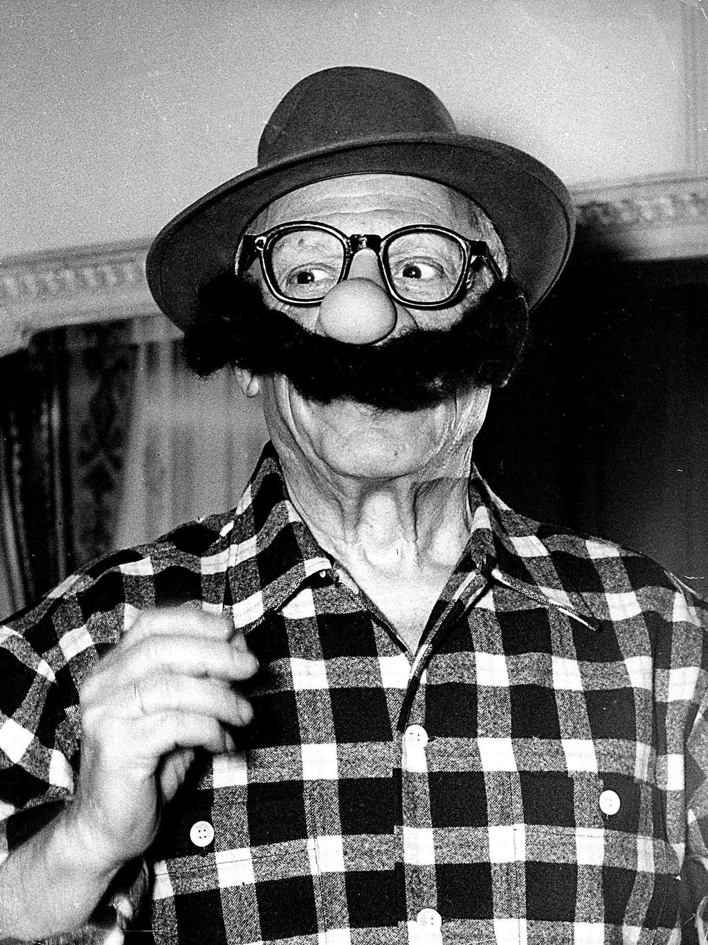 Pablo Picasso Holding Funny Mask