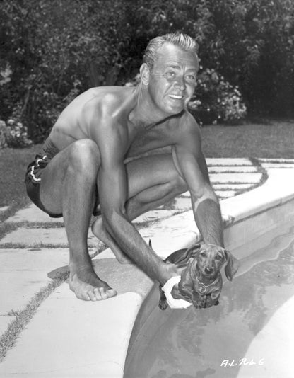 Alan Ladd Playing with Dog in Pool