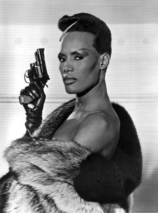 Grace Jones Holding Pistol