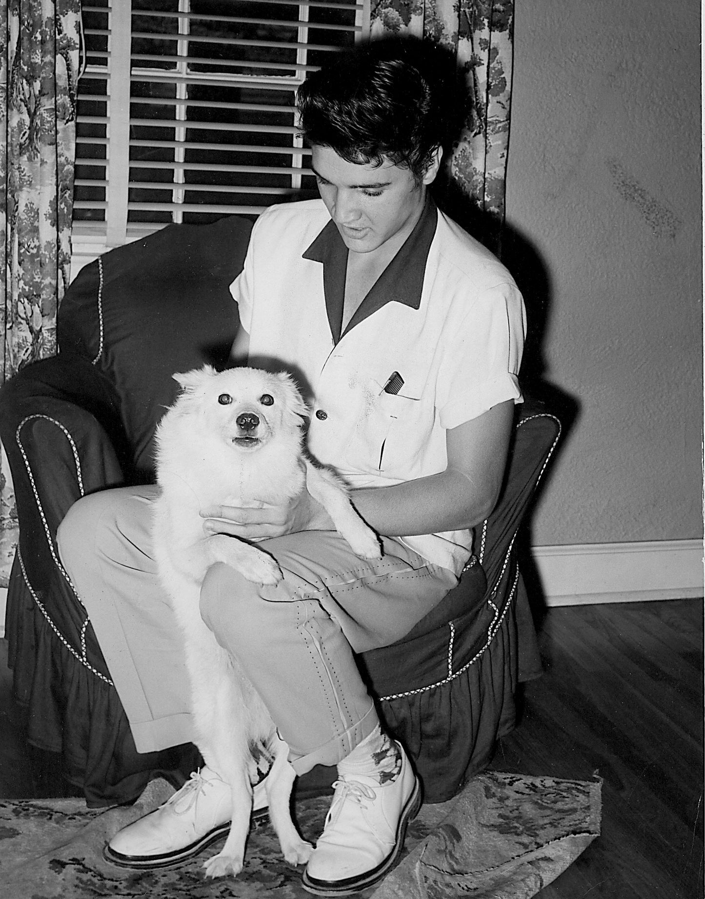 Elvis Presley Holding Dog
