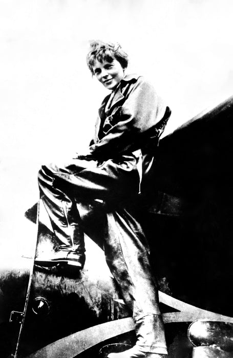 Amelia Earhart Climbing Into an Airplane