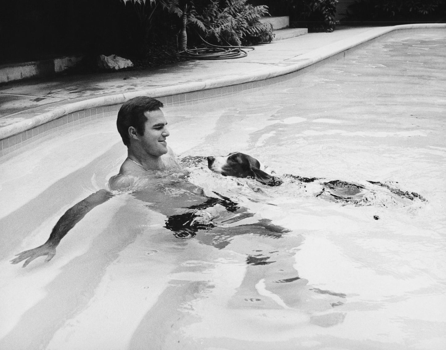 Burt Reynolds Swimming with His Basset Hound