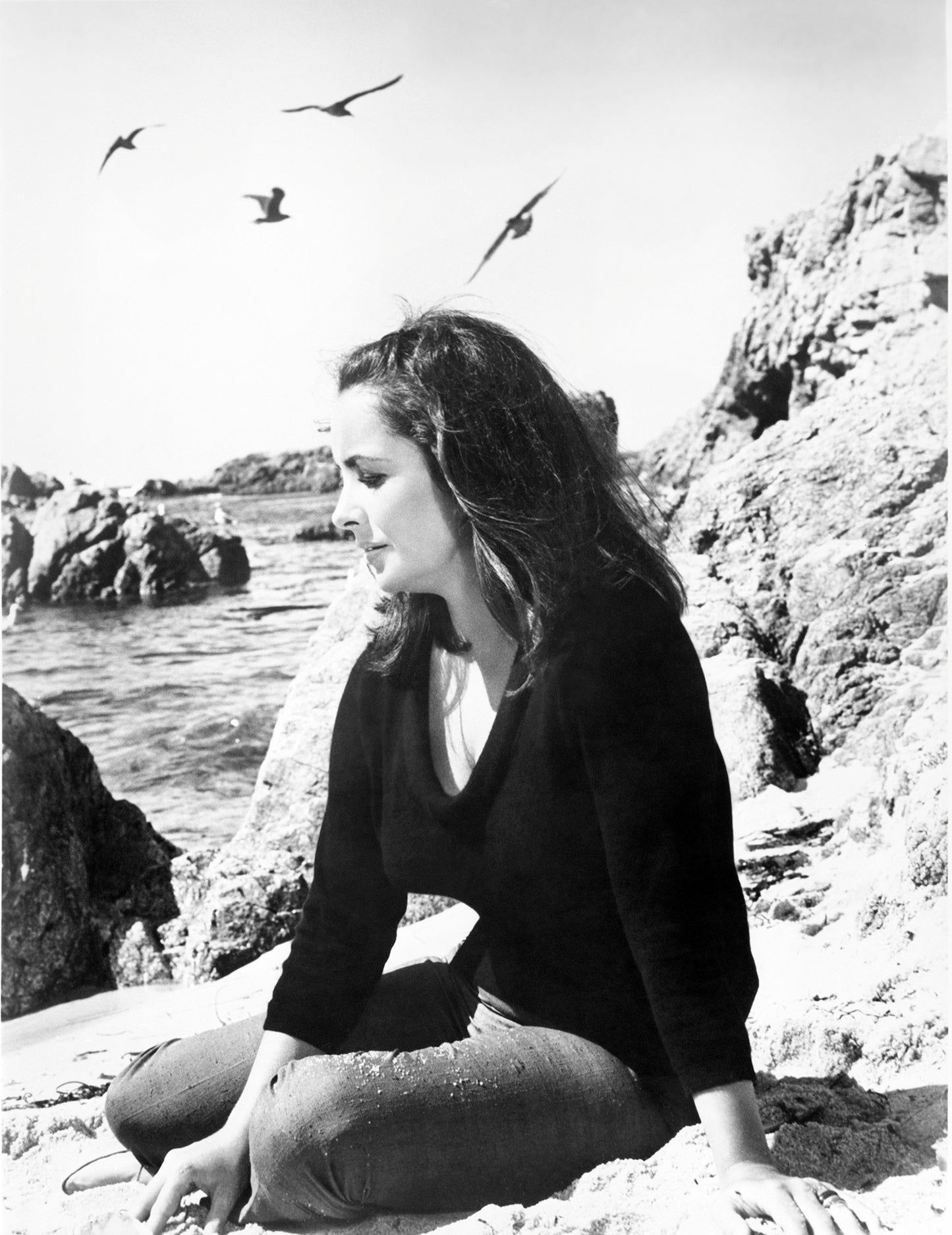 Elizabeth Taylor Sitting on Beach