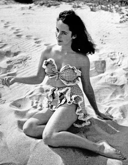 Elizabeth Taylor Sitting on Sand