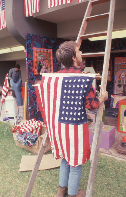 Attendee with Flag at Monterey Pop Festival
