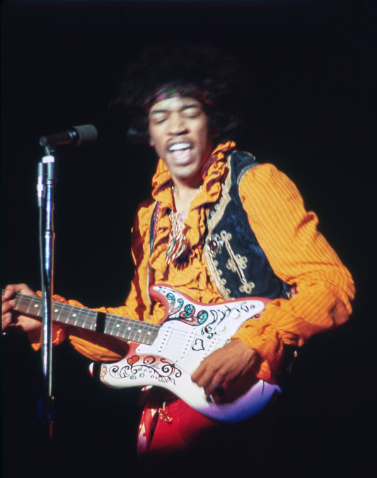 Jimi Hendrix Playing Guitar on Stage