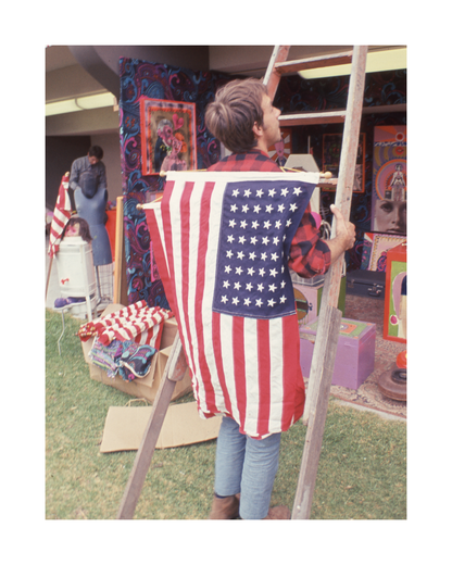 Attendee with Flag at Monterey Pop Festival