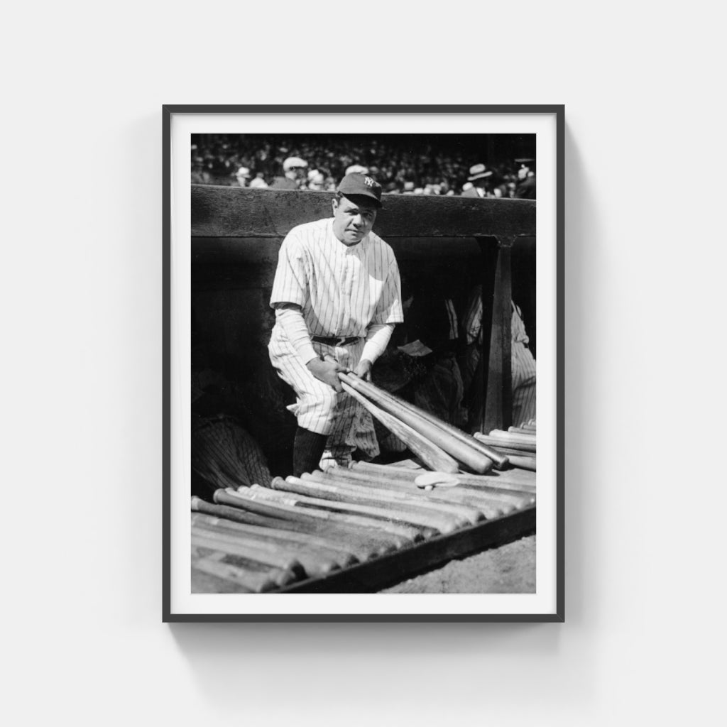 Babe Ruth Holding Bats